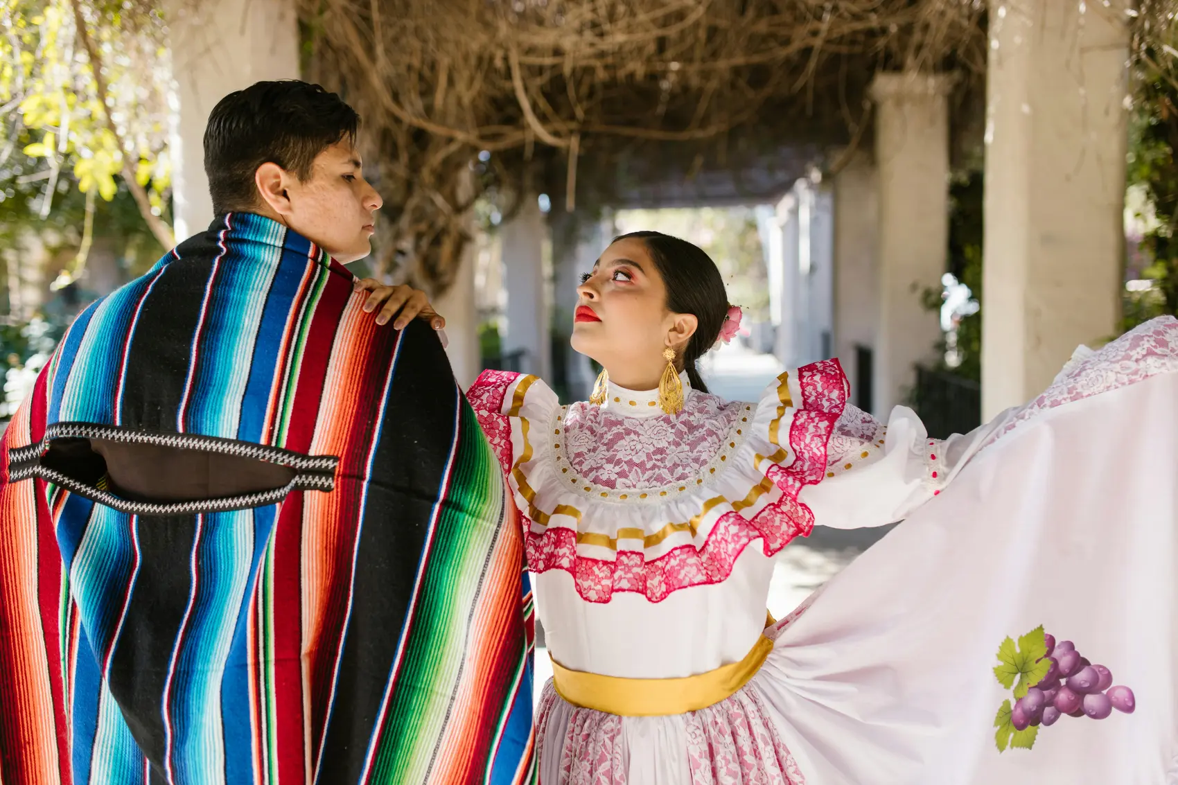 Couple wearing Mexican ponchos at music festival in the UK