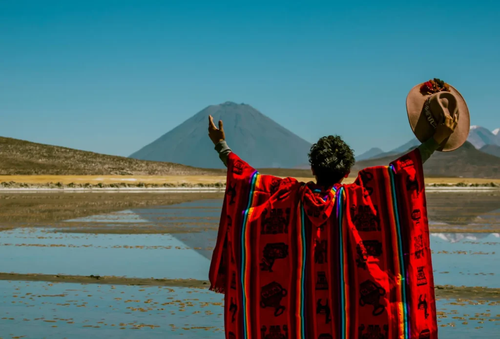 People wearing authentic Serape ponchos in volcanic landscape – symbol of Mexican culture
