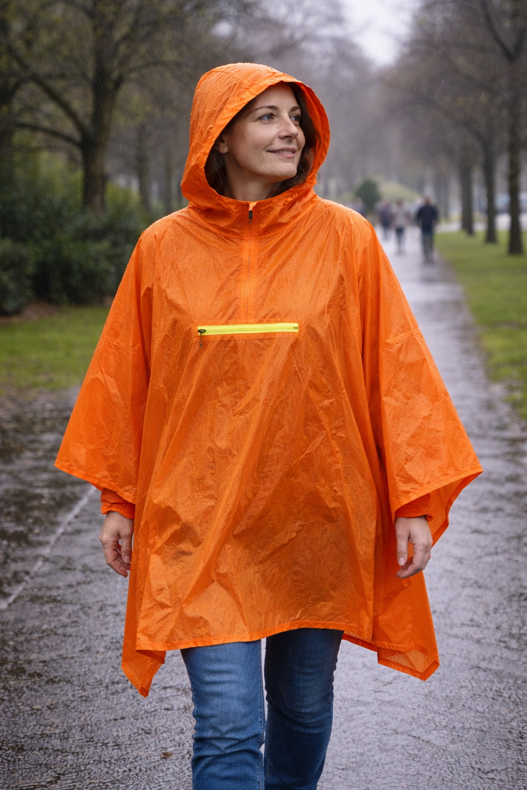 Orange Shield waterproof poncho showing hood, zip and reflective back strip