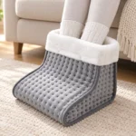 Front view of both socked feet in the FootNest grey electric foot warmer