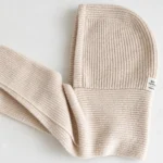 Close-up of the beige FrostHood ribbed knit and connected hood and scarf