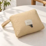 Naturehike camping blanket folded into its integrated storage pocket with carry handle