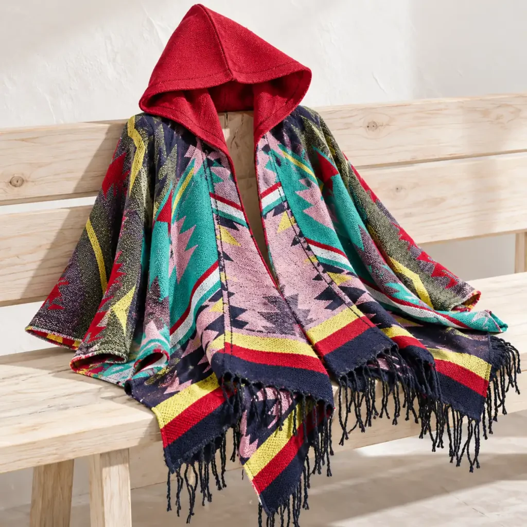 Andean Red poncho hood patterned knit and fringe detail