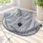 Unplugged ShoulderEase heated wrap air drying on a rack